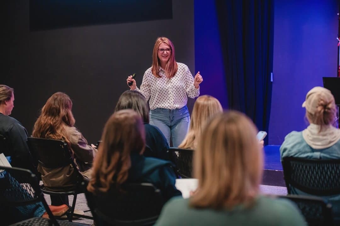 A group talks to one another during a discipleship class